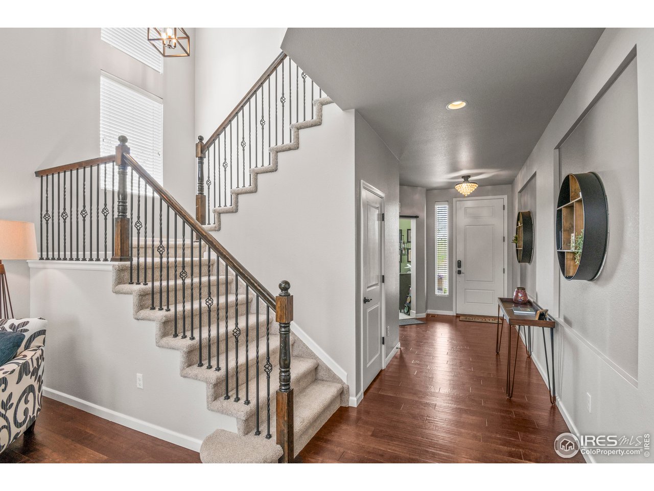 9570 Kendrick Way Arvada, CO 80007 - Photo 3 of 43 a view of entryway and hall with wooden floor