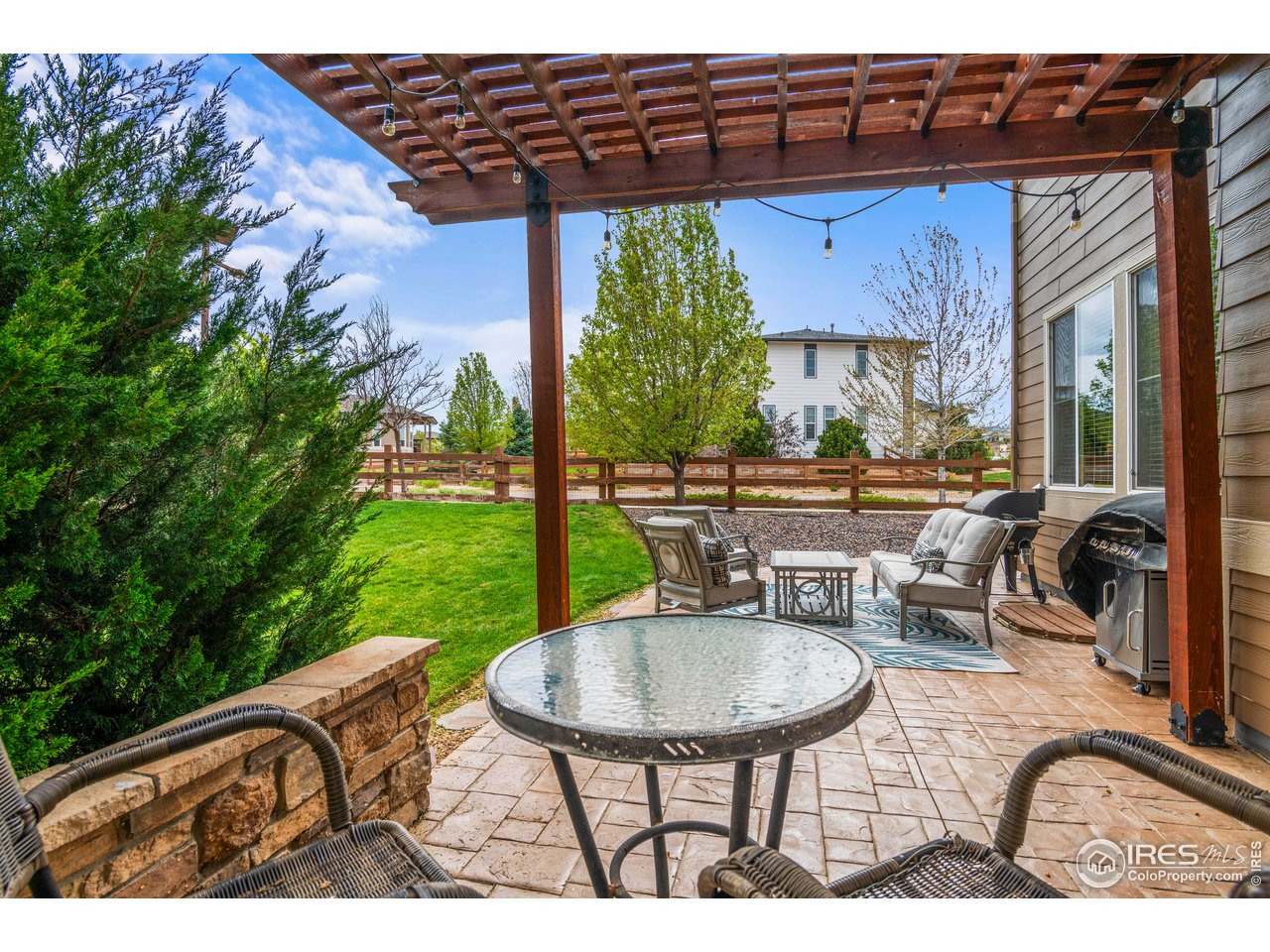 9570 Kendrick Way Arvada, CO 80007 - Photo 35 of 43 a view of a chairs and table in the patio