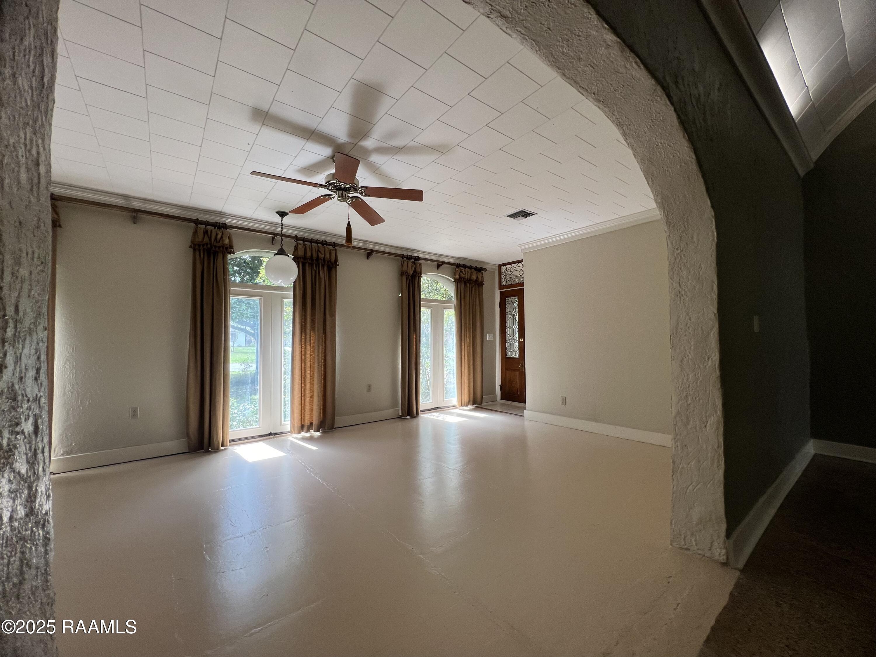 301 North Mall Street Lafayette, LA 70503 - Photo 6 of 38 Living Room from Dining Room Archway