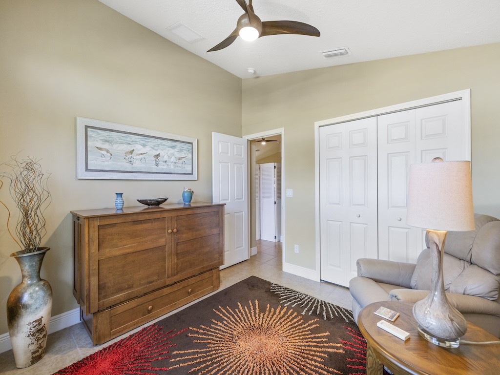 605 Monarch Way Sebastian, FL 32958 - Photo 16 of 36 a living room with furniture and a rug