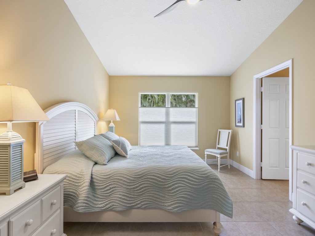 605 Monarch Way Sebastian, FL 32958 - Photo 21 of 36 a bedroom with a bed and a window