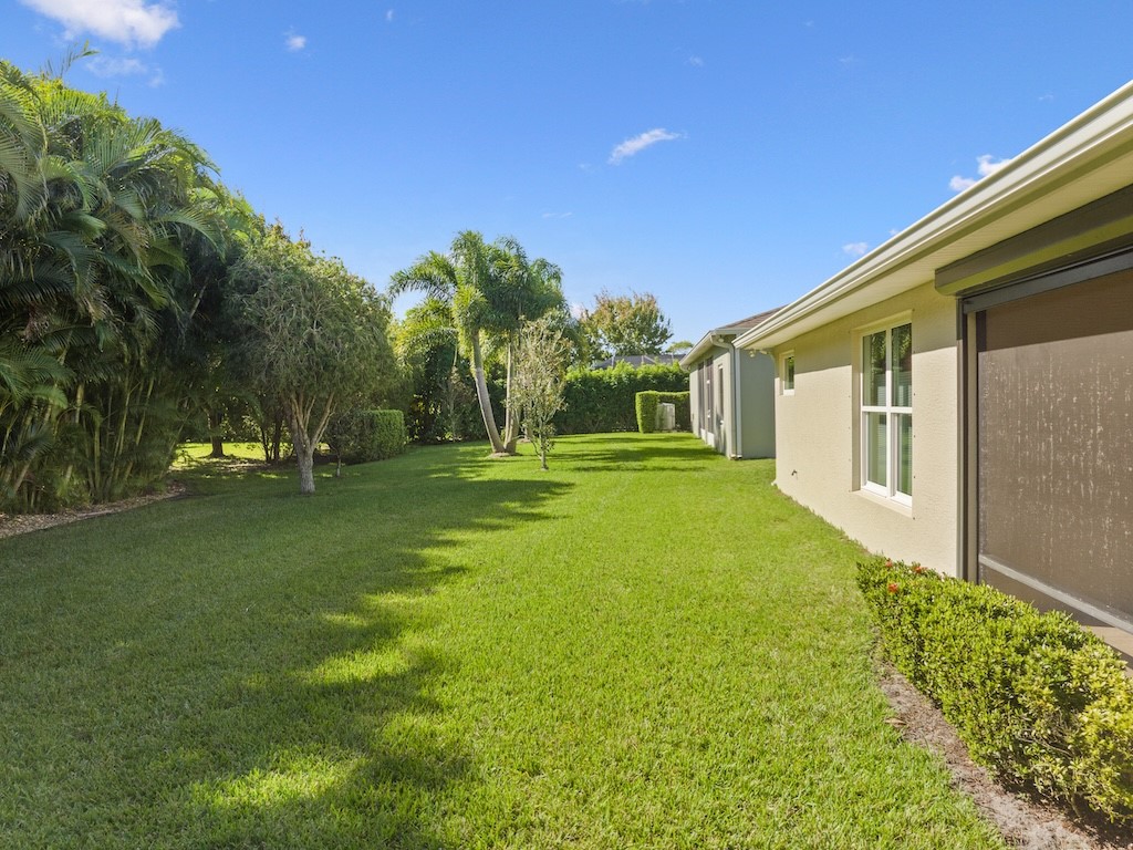 605 Monarch Way Sebastian, FL 32958 - Photo 23 of 36 a front view of a house with a yard