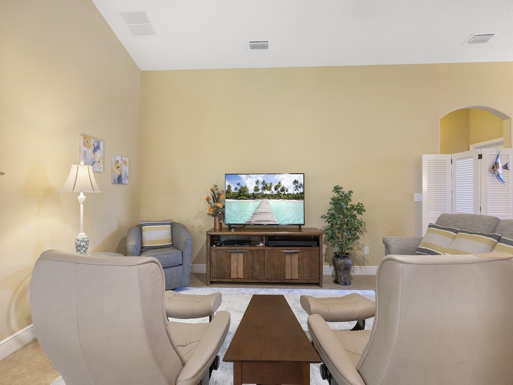 605 Monarch Way Sebastian, FL 32958 - Photo 9 of 36 a living room with furniture and a flat screen tv