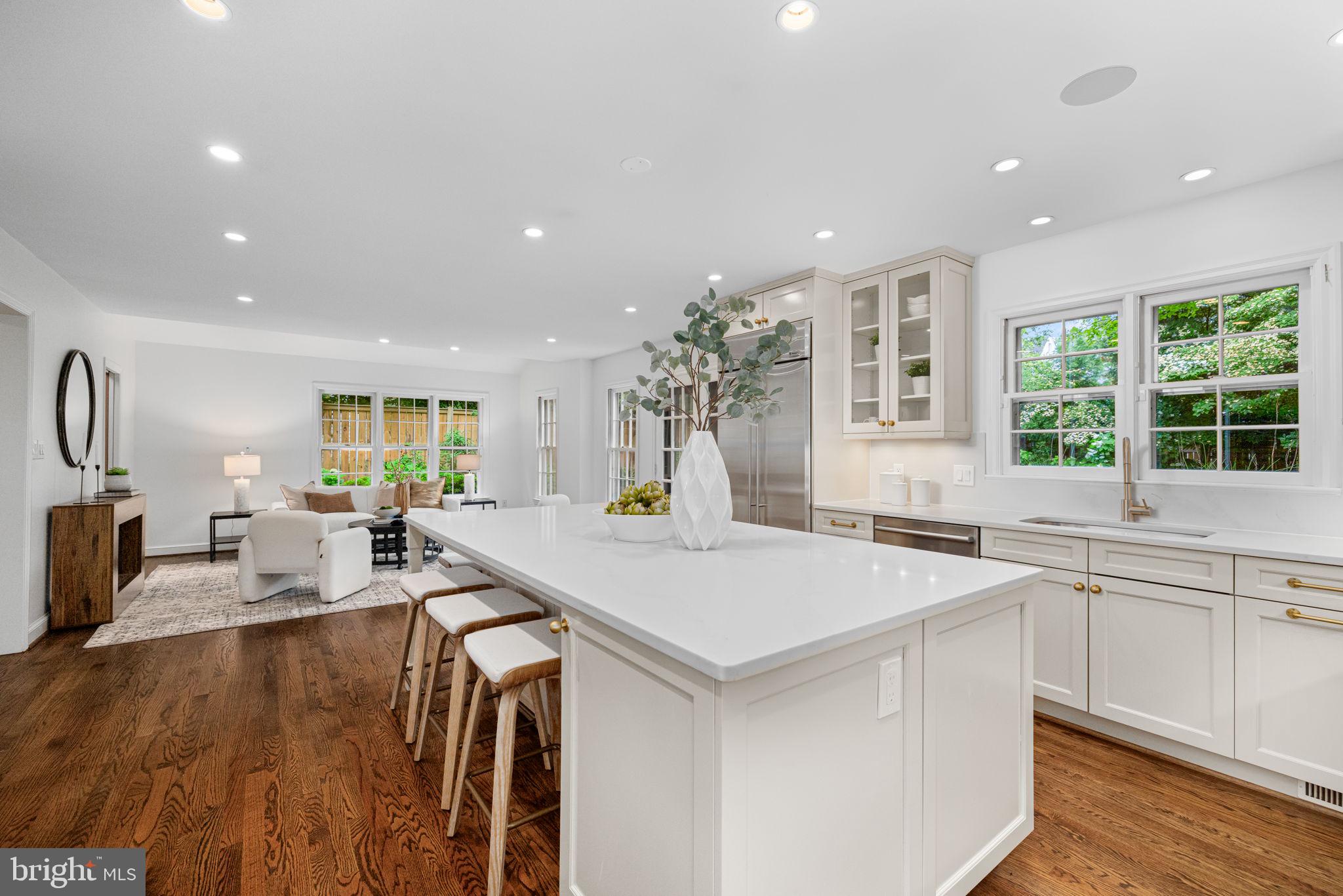 4822 Upton Street Northwest Washington, DC 20016 - Photo 11 of 48 a large kitchen with sink a counter top space and living room view