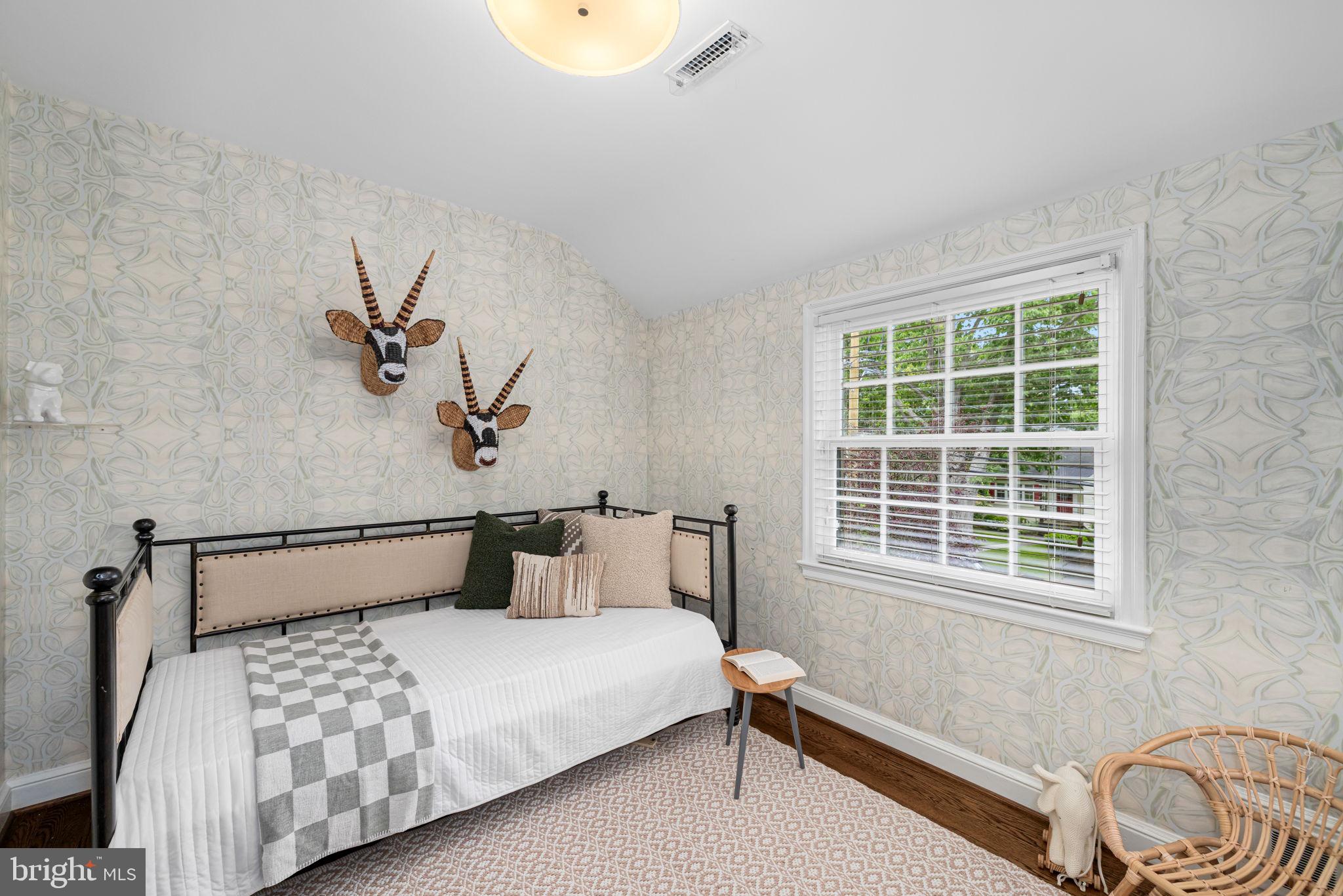 4822 Upton Street Northwest Washington, DC 20016 - Photo 26 of 48 a bedroom with a bed and a window