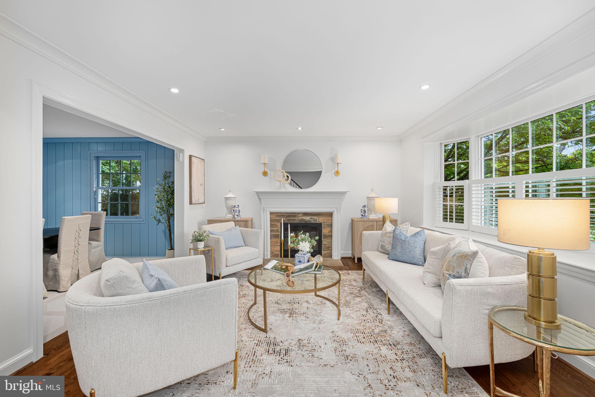 4822 Upton Street Northwest Washington, DC 20016 - Photo 3 of 48 a living room with furniture and a fireplace