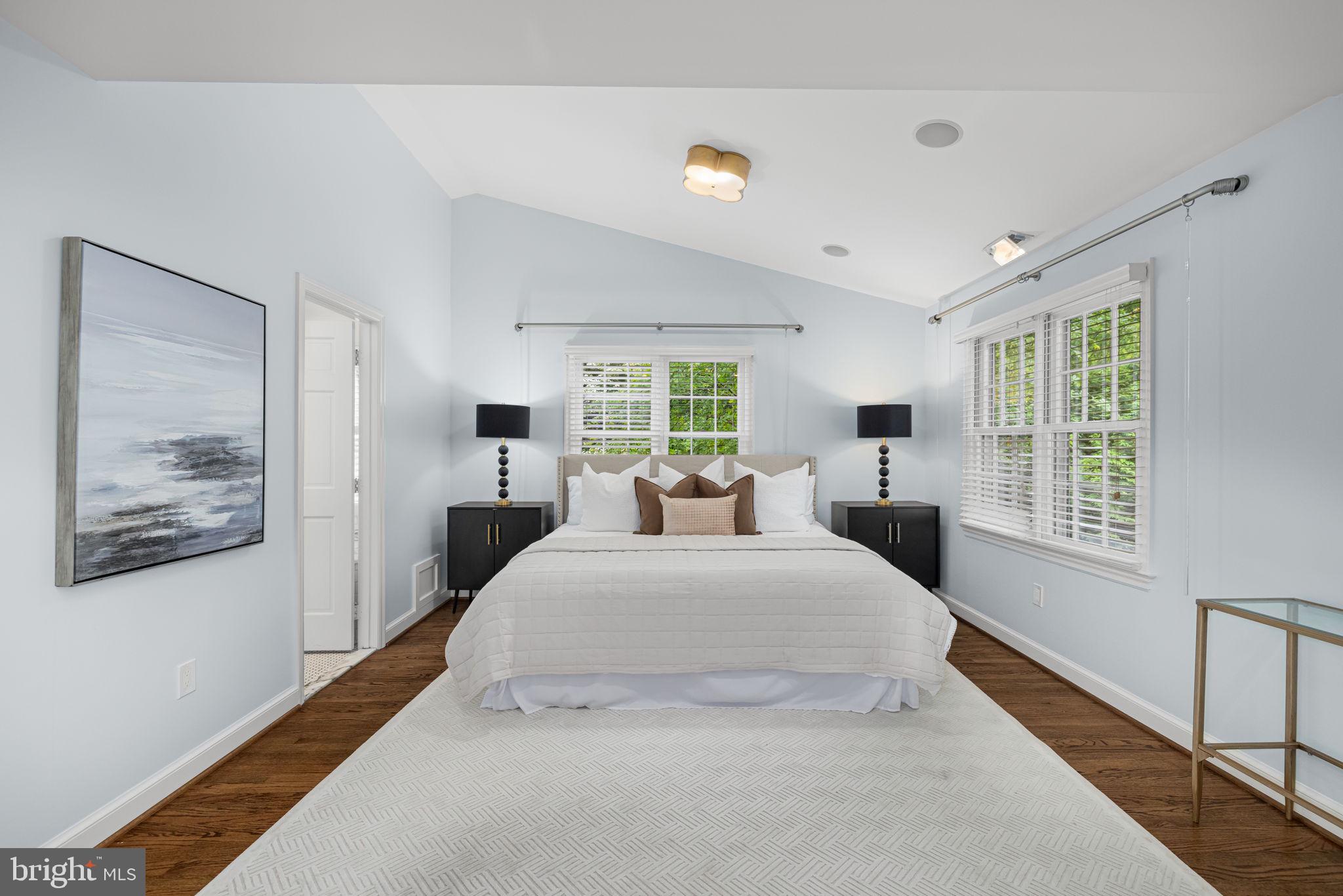 4822 Upton Street Northwest Washington, DC 20016 - Photo 32 of 48 a spacious bedroom with a large bed and a window