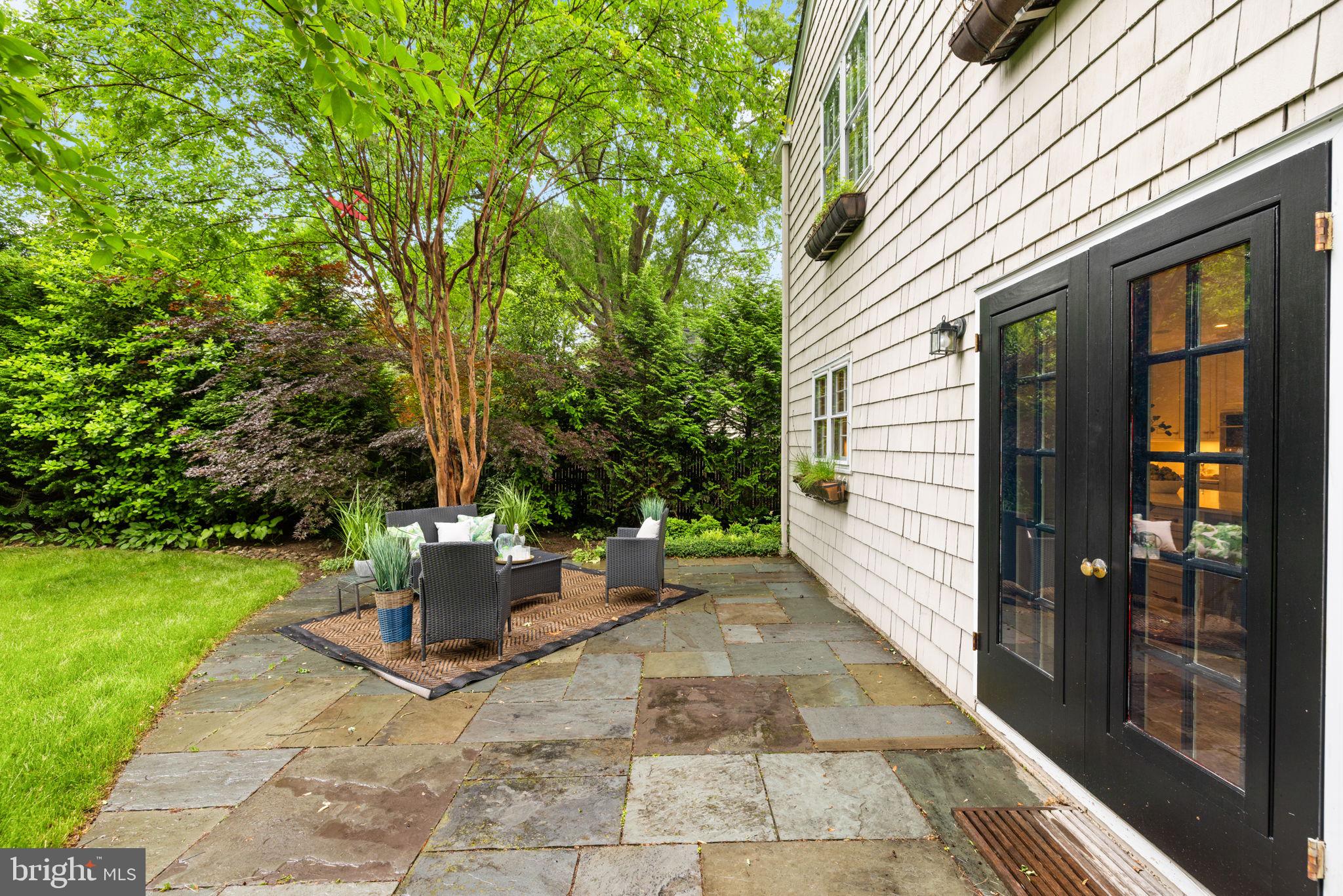 4822 Upton Street Northwest Washington, DC 20016 - Photo 45 of 48 a view of a patio with table and chairs and potted plants