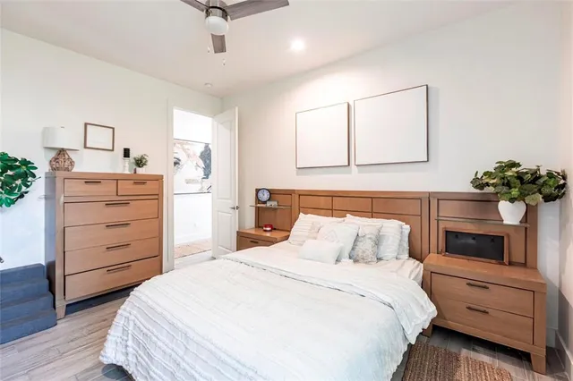 a bedroom with a bed and a dresser