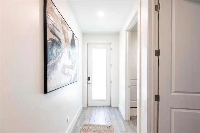 a view of entryway with wooden floor