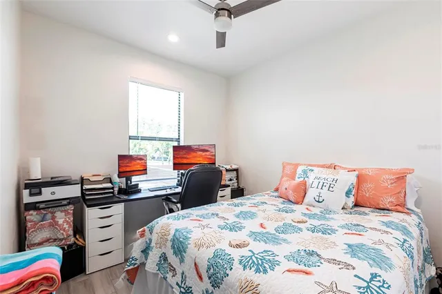 a bedroom with a bed and furniture