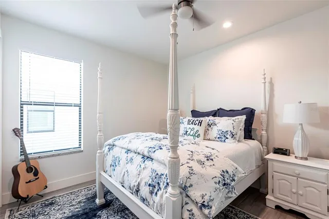 a bedroom with bed and window