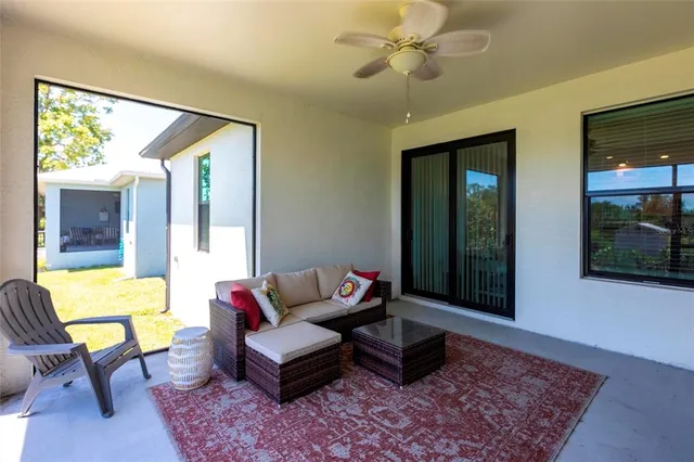 a living room with furniture and a window