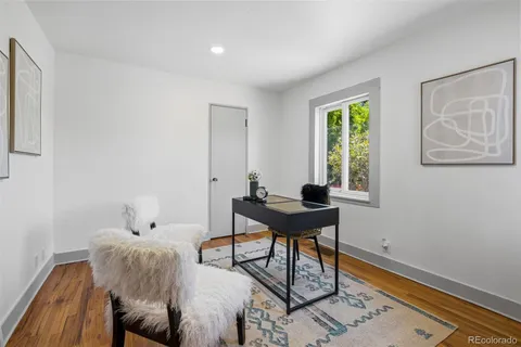 a workspace with furniture and window