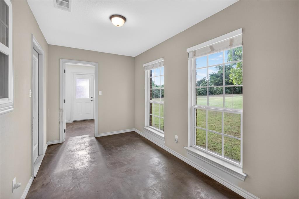 505 East 5th Street Springtown, TX 76082 - Photo 33 of 39 an empty room with windows