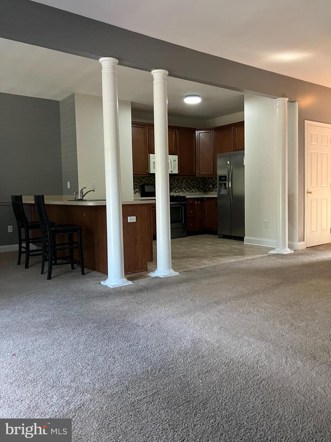 129 Sequoia Drive Berlin, NJ 08009 - Photo 3 of 17 a view of a kitchen with a sink and cabinets