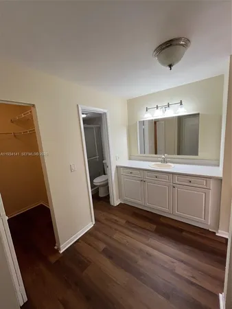 a bathroom with a double vanity sink and mirror