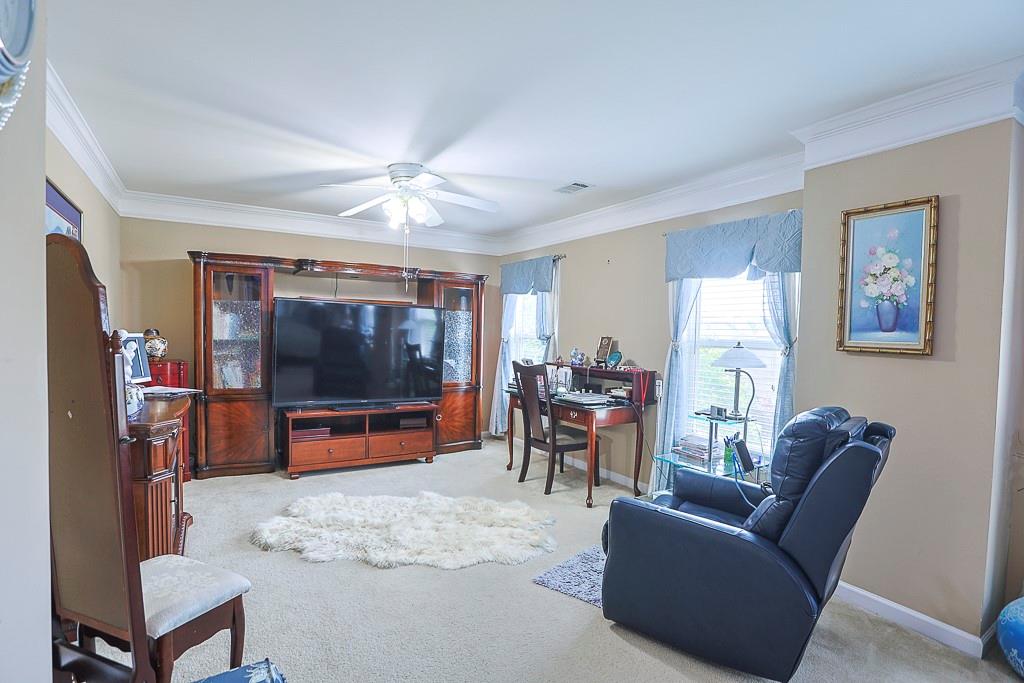 300 Hampton Place Canton, GA 30115 - Photo 56 of 82 a living room with furniture and a flat screen tv