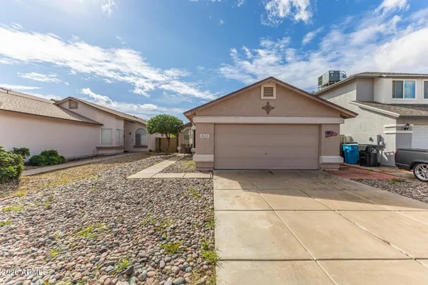 a front view of a house with a garage