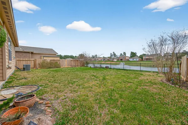 a view of a house with a yard and sitting area