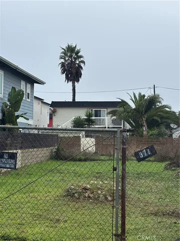 a swimming pool with outdoor seating and yard