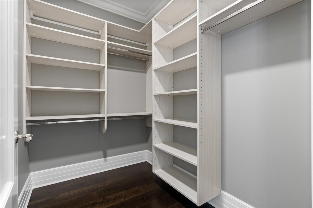 9 West Walton Street, Unit 702 Chicago, IL 60610 - Photo 33 of 38 a view of walk in closet with empty racks