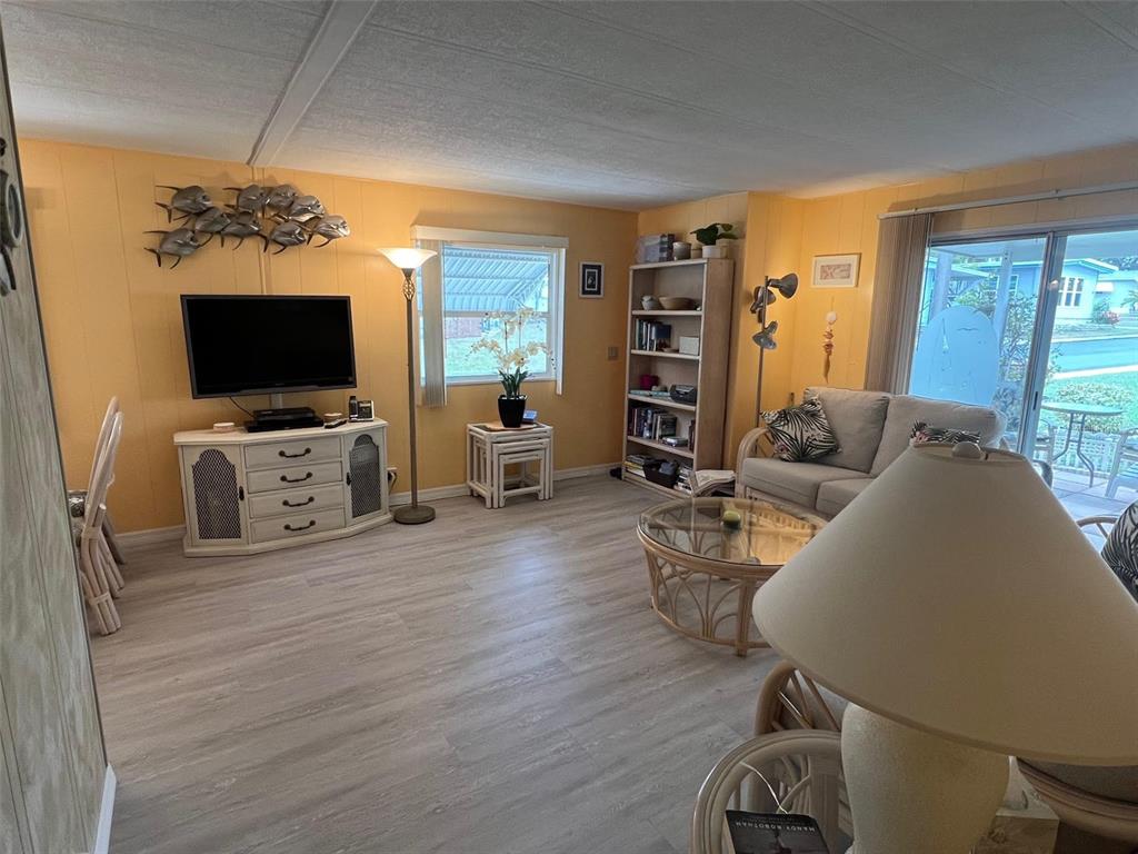 52 Frangipani Circle Largo, FL 33770 - Photo 15 of 33 a living room with furniture and a flat screen tv