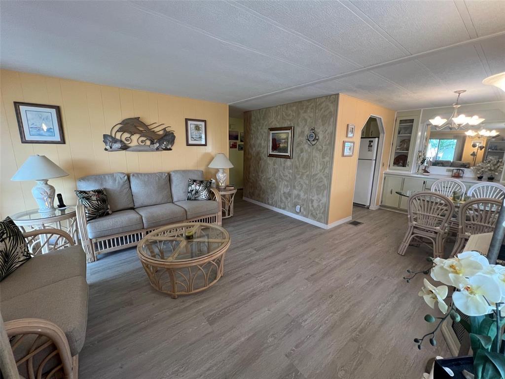 52 Frangipani Circle Largo, FL 33770 - Photo 16 of 33 a living room with furniture and a wooden floor