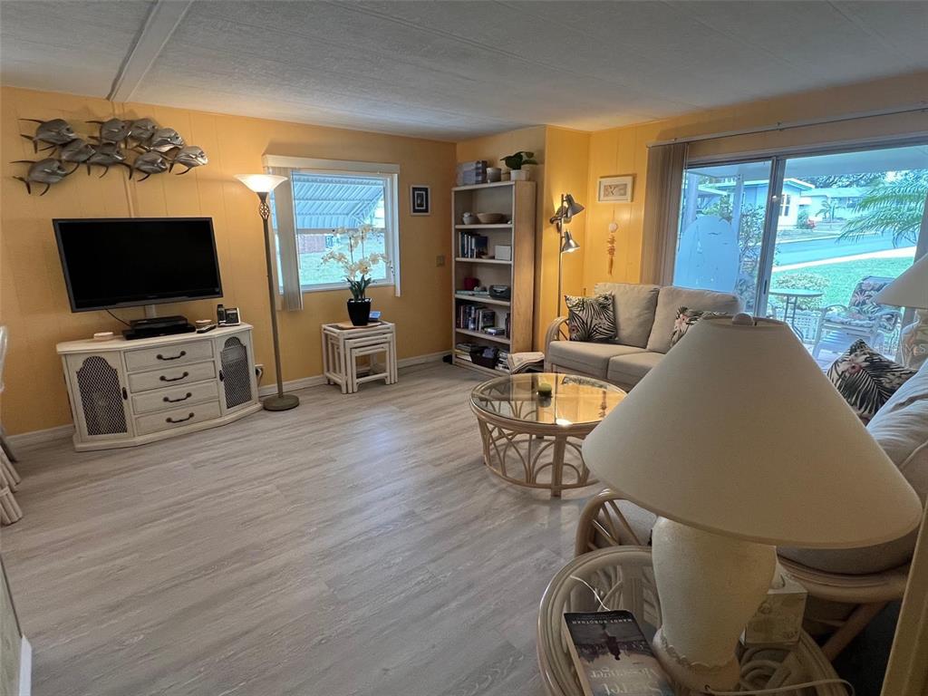52 Frangipani Circle Largo, FL 33770 - Photo 17 of 33 a living room with furniture and a flat screen tv