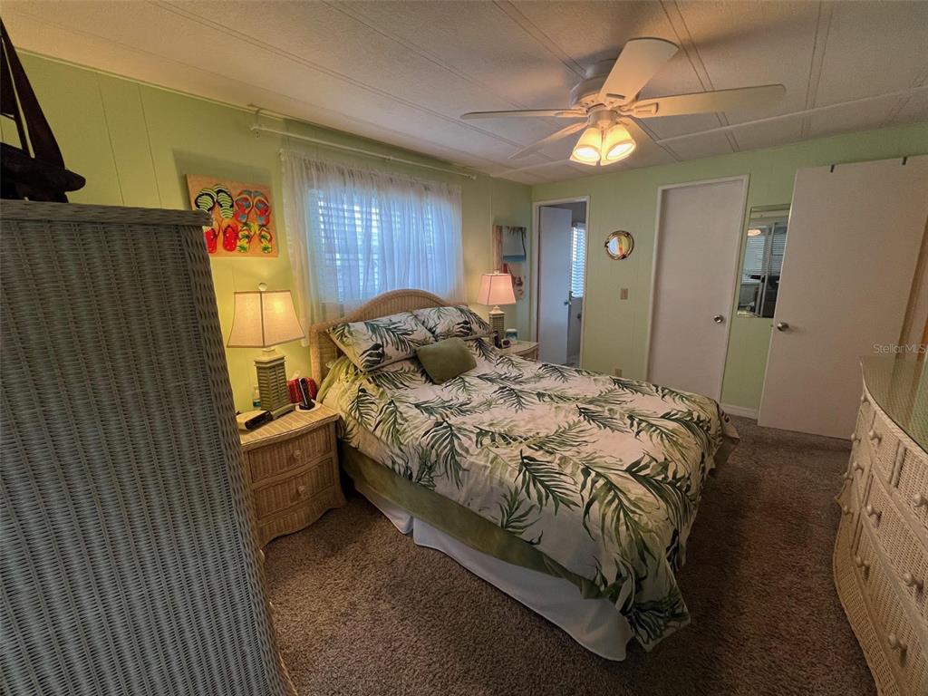 52 Frangipani Circle Largo, FL 33770 - Photo 19 of 33 a bedroom with a bed and a window