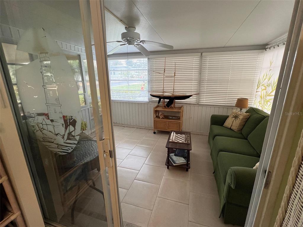 52 Frangipani Circle Largo, FL 33770 - Photo 22 of 33 a living room with furniture and a window