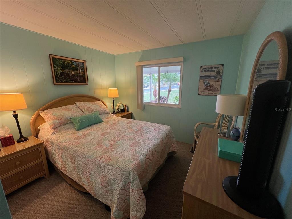 52 Frangipani Circle Largo, FL 33770 - Photo 27 of 33 a bed sitting in a bedroom next to a window