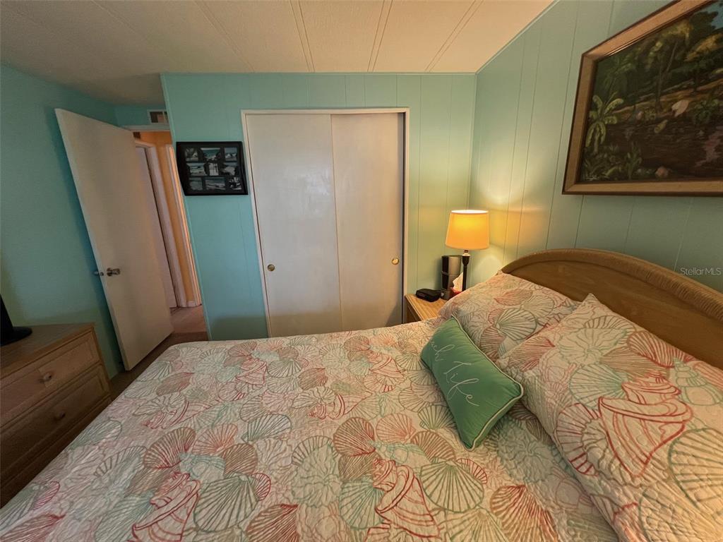 52 Frangipani Circle Largo, FL 33770 - Photo 28 of 33 a bedroom with a bed and a window