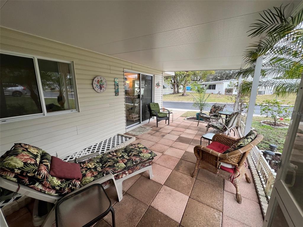 52 Frangipani Circle Largo, FL 33770 - Photo 5 of 33 a outdoor space with lots of stuff and furniture