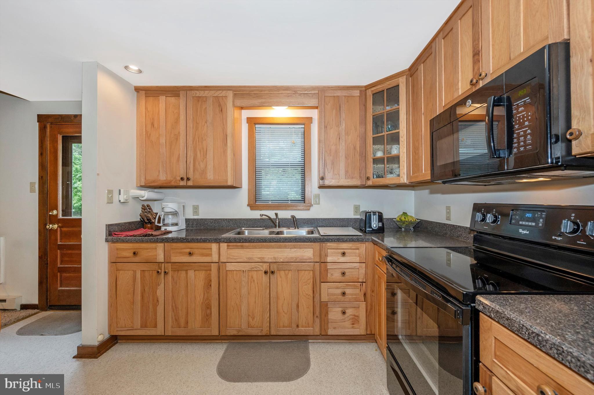 9301 Hamburg Road Frederick, MD 21702 - Photo 11 of 57 a kitchen with stainless steel appliances granite countertop a stove sink and cabinets