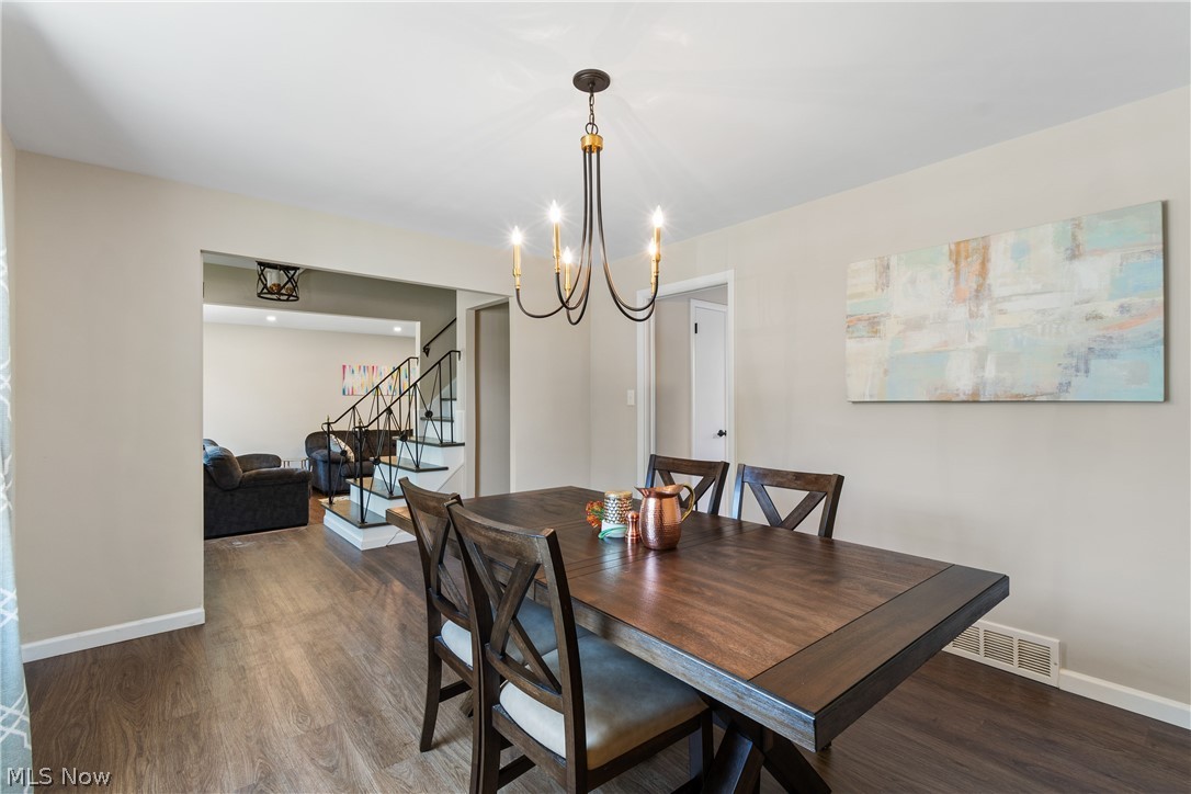 4503 Groveland Road University Heights, OH 44118 - Photo 10 of 31 Dining space featuring an inviting chandelier and hardwood / wood-style flooring