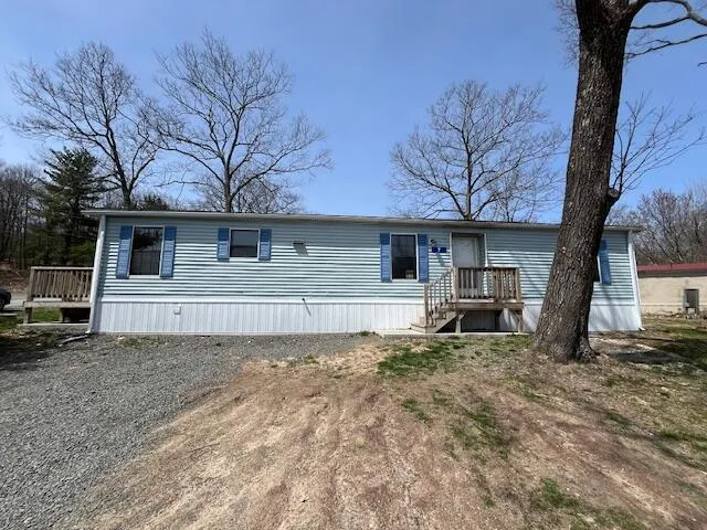 a front view of a house with garage