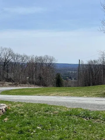 a view of a field with a big yard