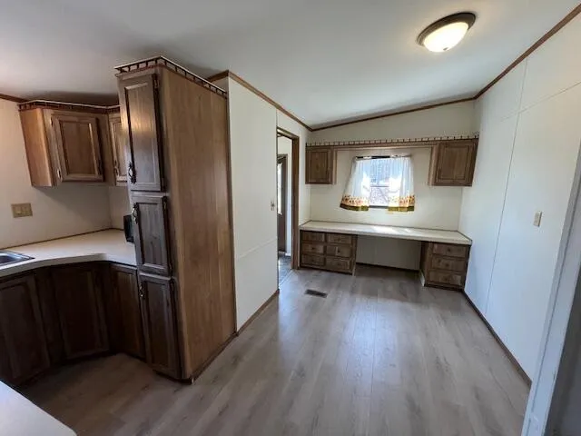 a kitchen with stainless steel appliances a refrigerator and a sink
