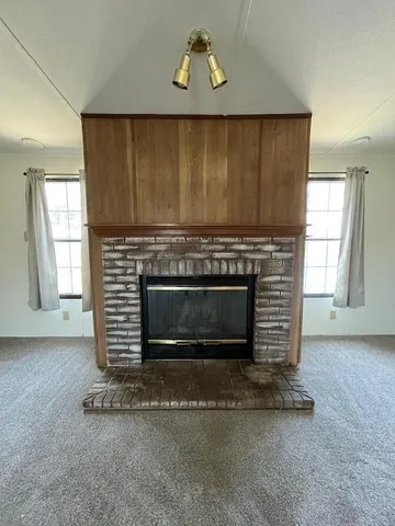 an empty room with a fireplace