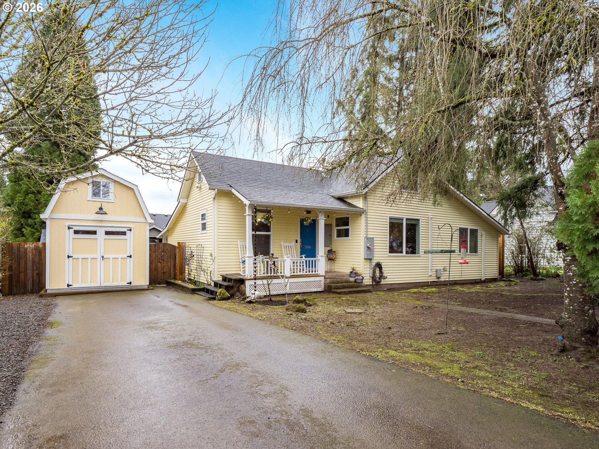 336 North 5th Street Carlton, OR 97111 - Photo 1 of 48 a big white house with a large tree in front of it
