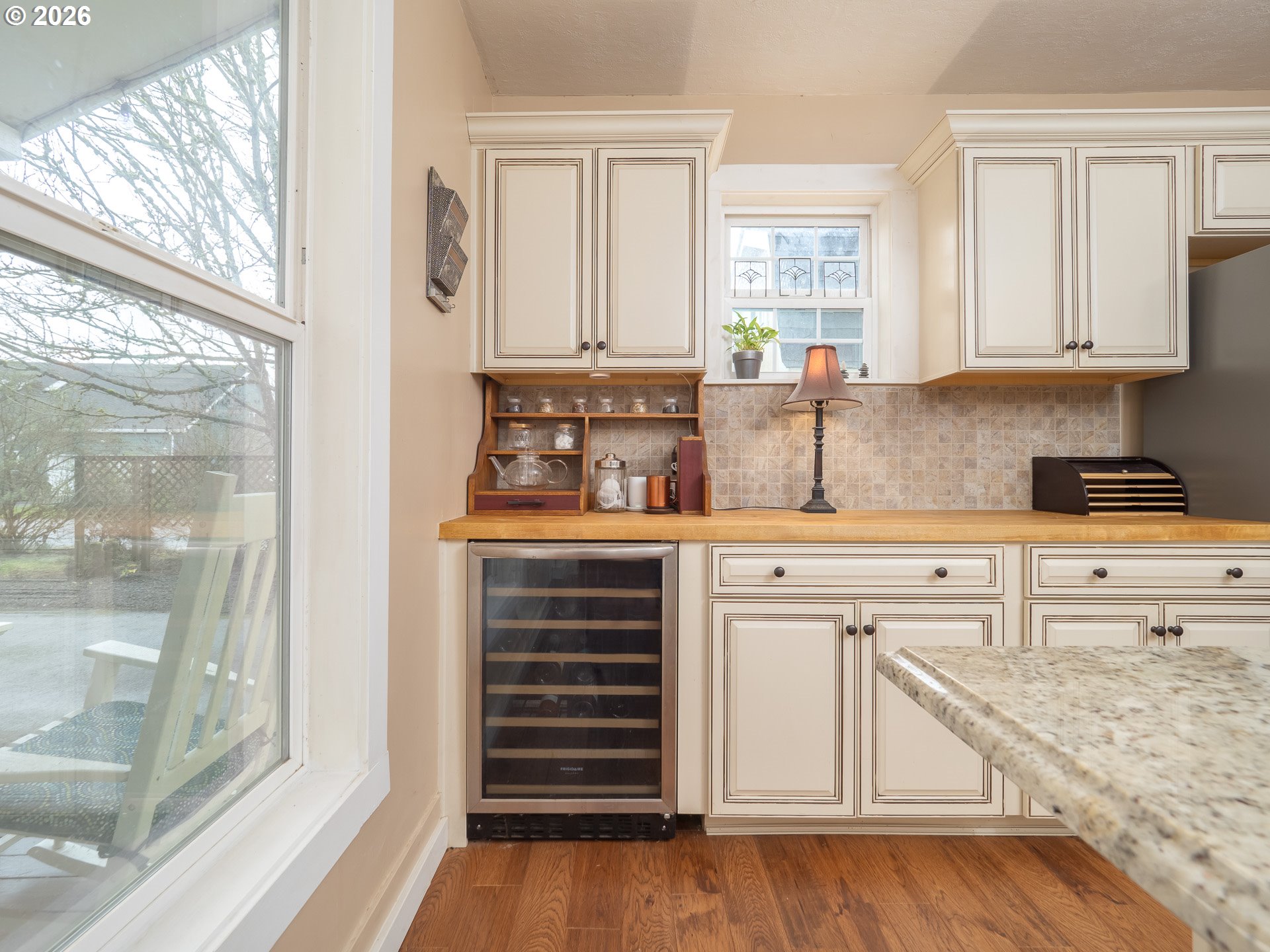 336 North 5th Street Carlton, OR 97111 - Photo 12 of 48 a kitchen with granite countertop white cabinets and white appliances