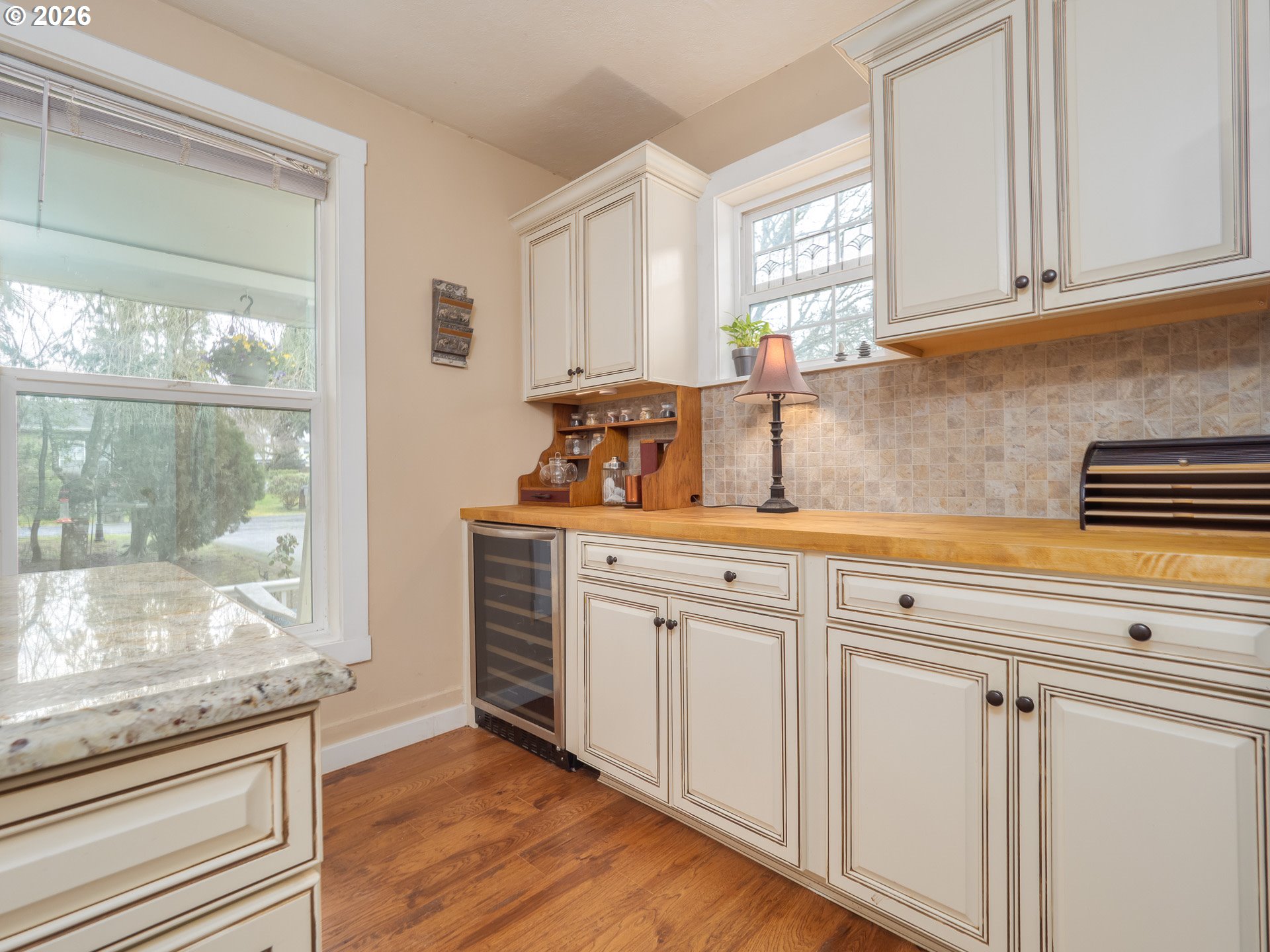 336 North 5th Street Carlton, OR 97111 - Photo 13 of 48 a kitchen with white cabinets and a window