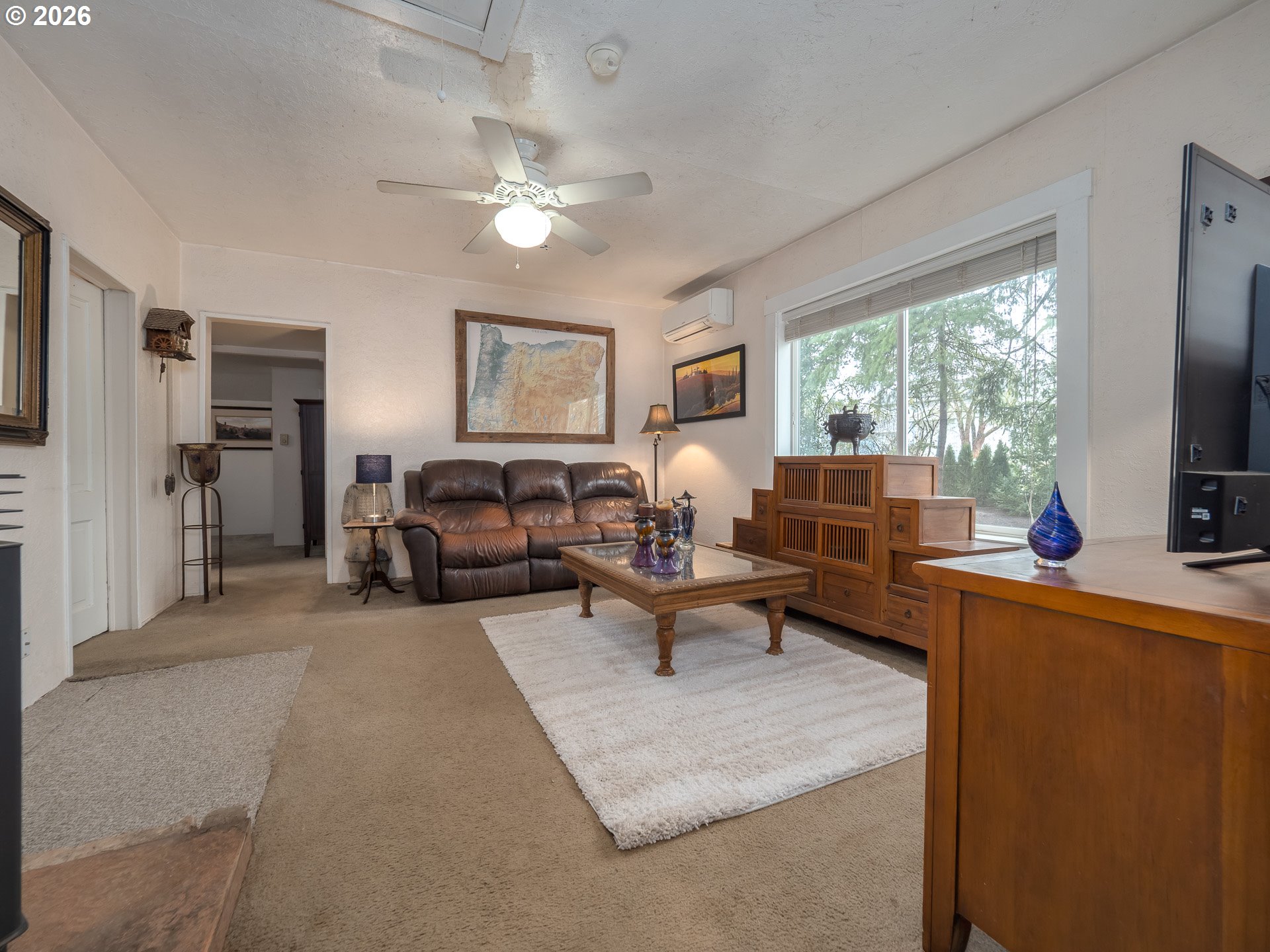 336 North 5th Street Carlton, OR 97111 - Photo 15 of 48 a living room with furniture a large window and a flat screen tv