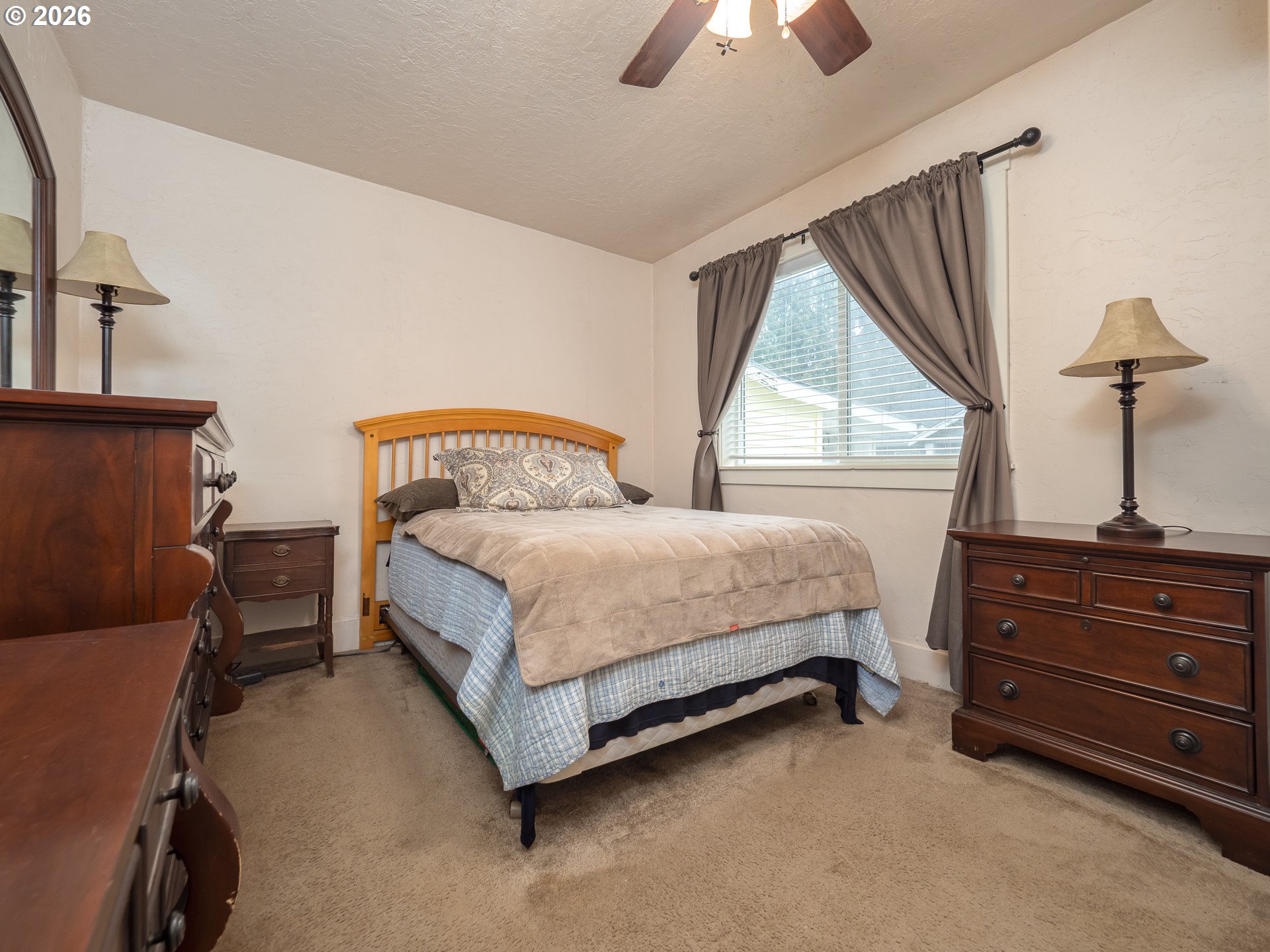336 North 5th Street Carlton, OR 97111 - Photo 20 of 48 a bedroom with a bed and a chandelier