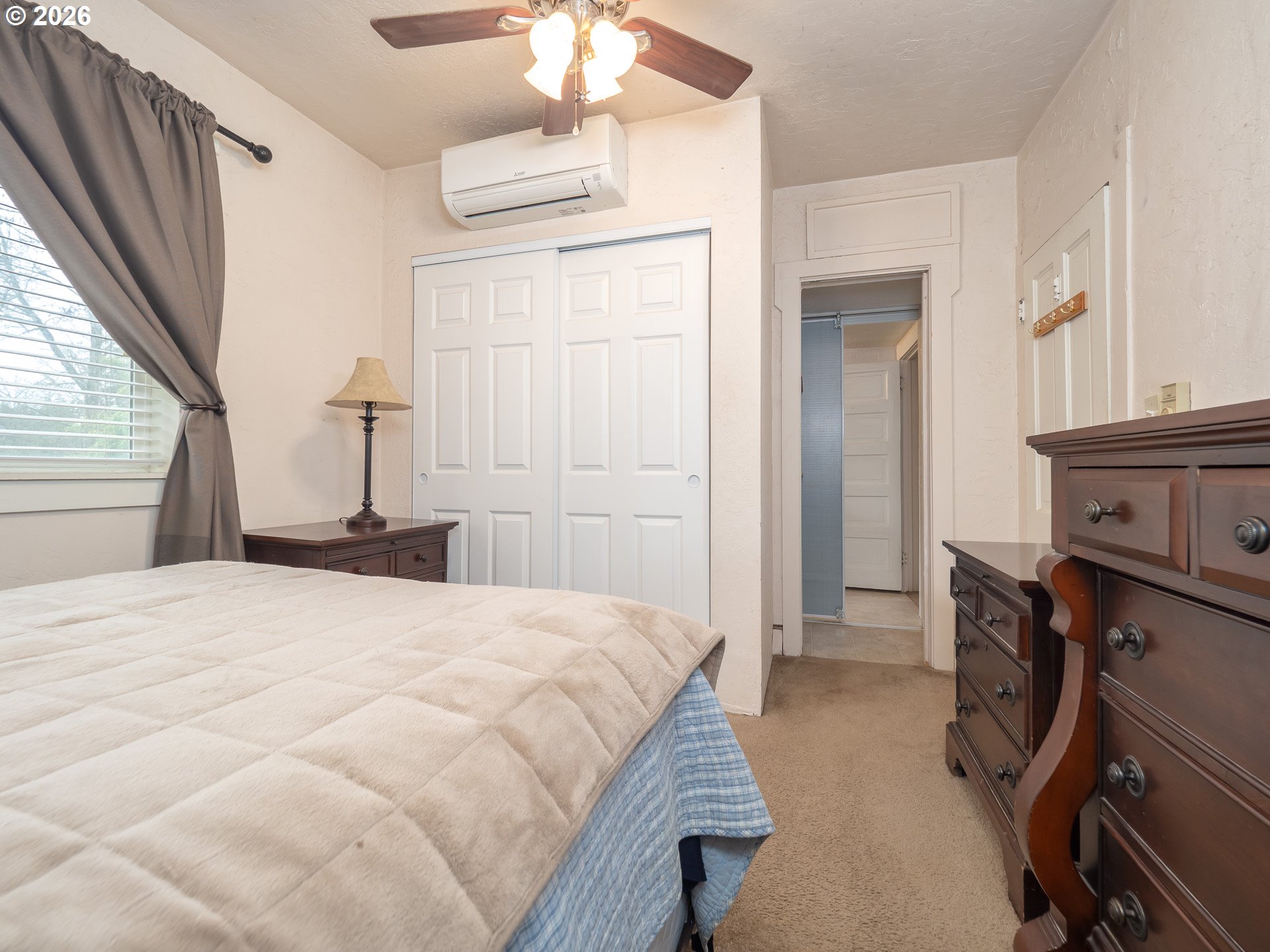 336 North 5th Street Carlton, OR 97111 - Photo 21 of 48 a bedroom with a bed and a chandelier