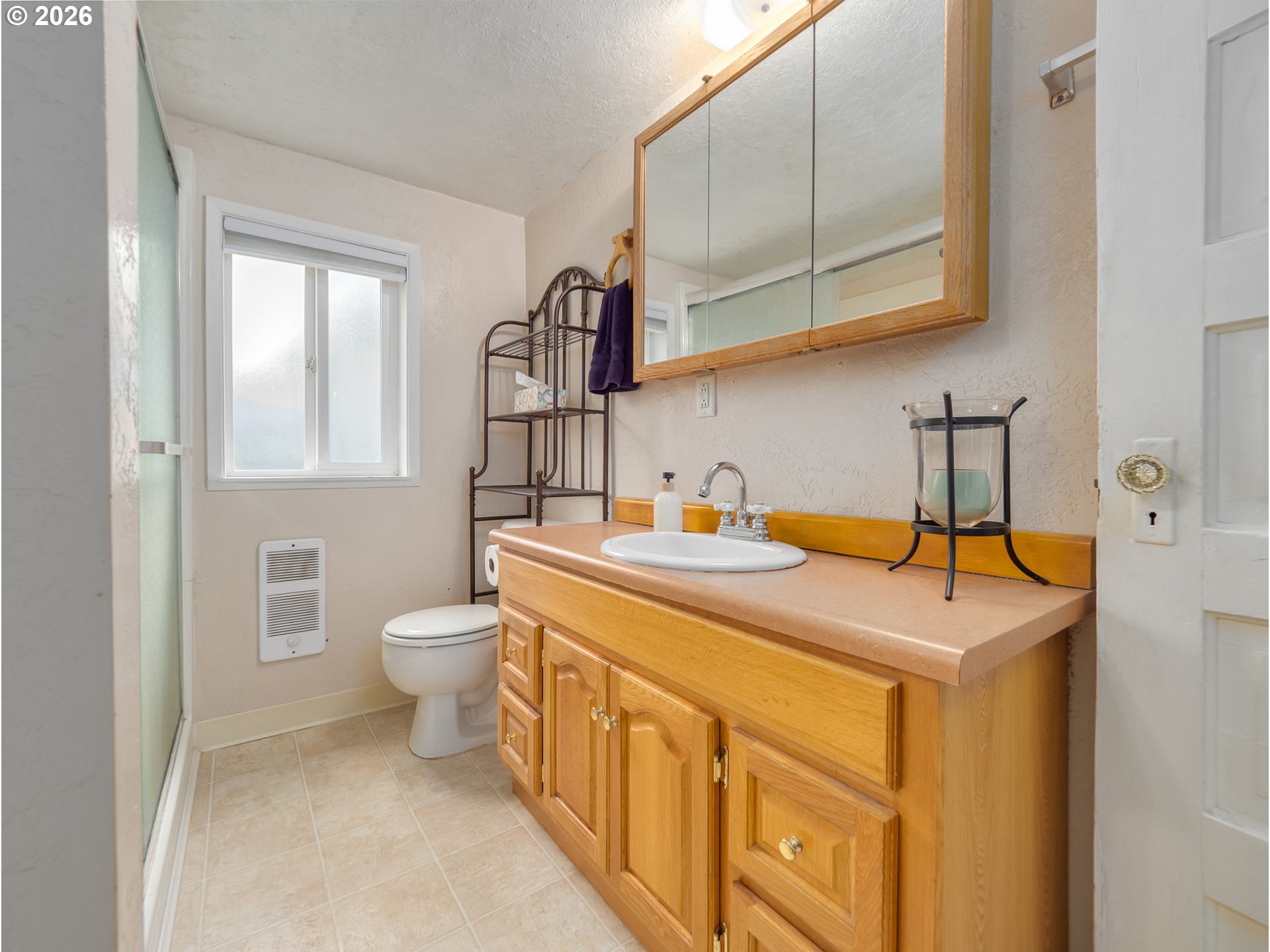 336 North 5th Street Carlton, OR 97111 - Photo 23 of 48 a bathroom with a sink a toilet and mirror
