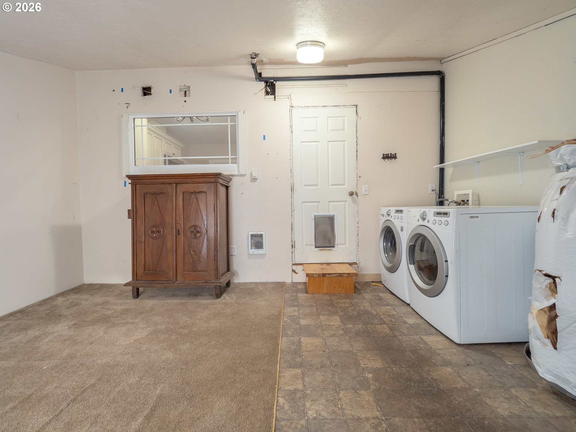 336 North 5th Street Carlton, OR 97111 - Photo 31 of 48 a view of a storage & utility room with washer and dryer