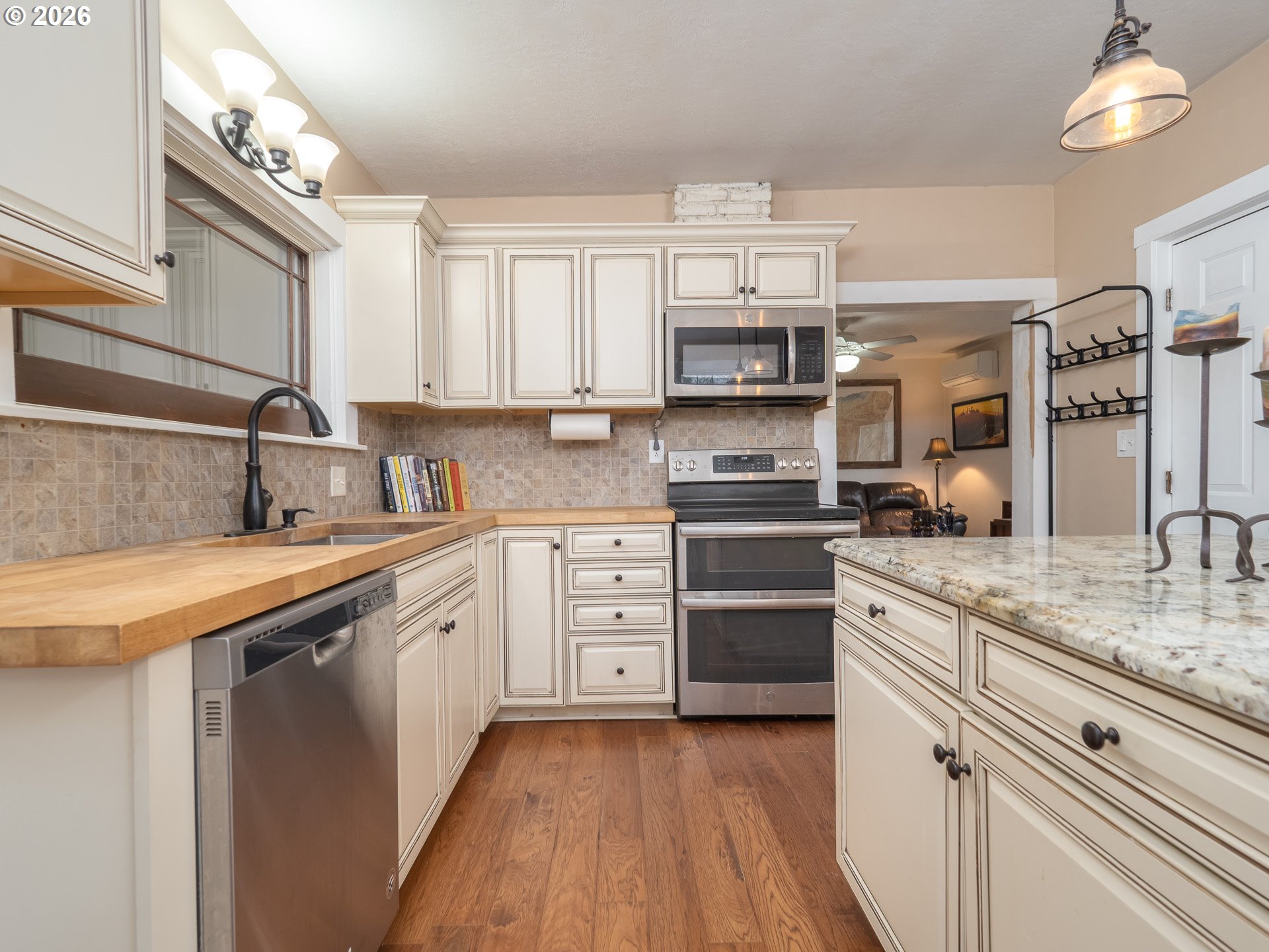 336 North 5th Street Carlton, OR 97111 - Photo 6 of 48 a kitchen with stainless steel appliances granite countertop a sink and cabinets