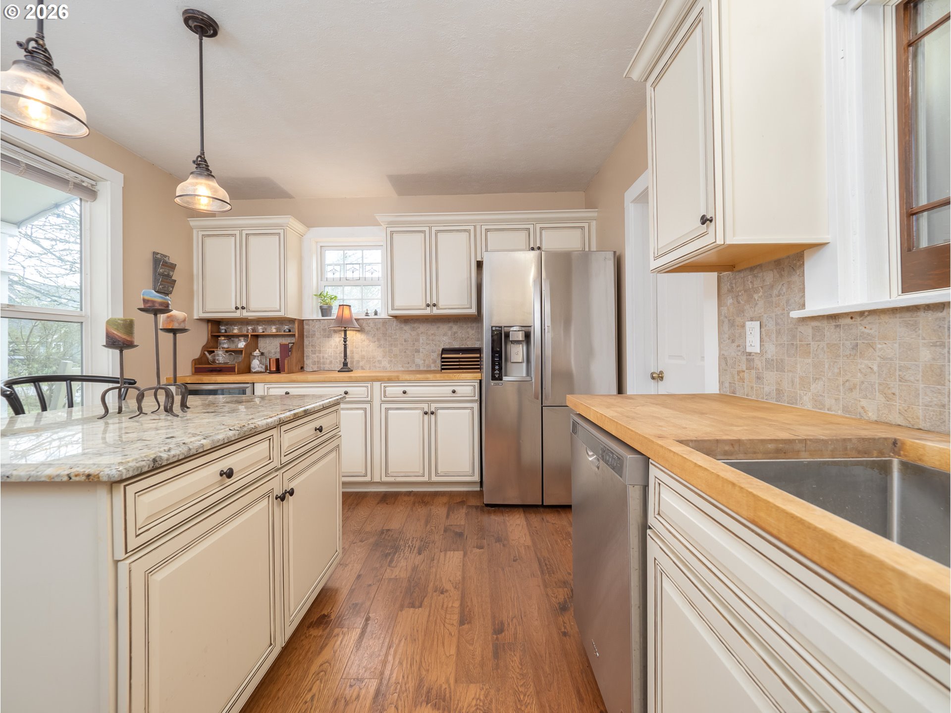 336 North 5th Street Carlton, OR 97111 - Photo 10 of 48 a kitchen with white cabinets appliances and a window